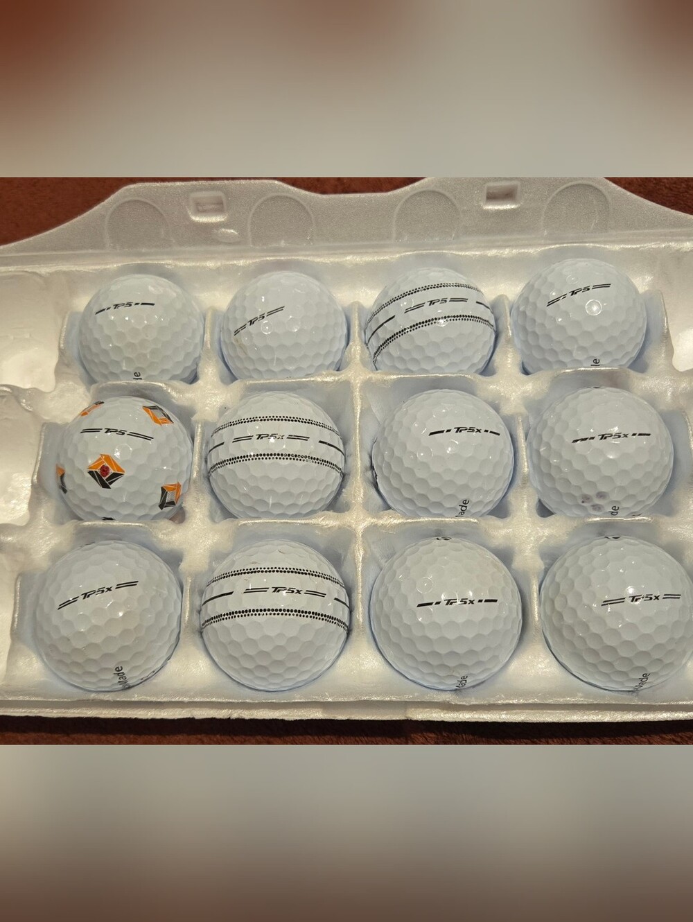 12 Taylormade TP5 & TP5x white golf balls. ristine 5A playing condition